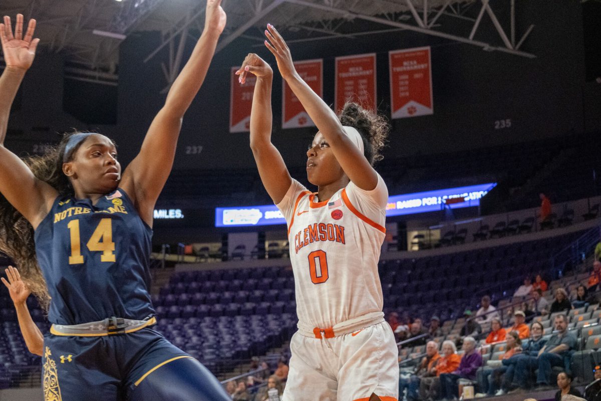 Clemson point guard Brie Perpignan (0) shoots over a Notre Dame defender during the Tigers game against the Fighting Irish in Littlejohn Coliseum on Jan. 19, 2022.