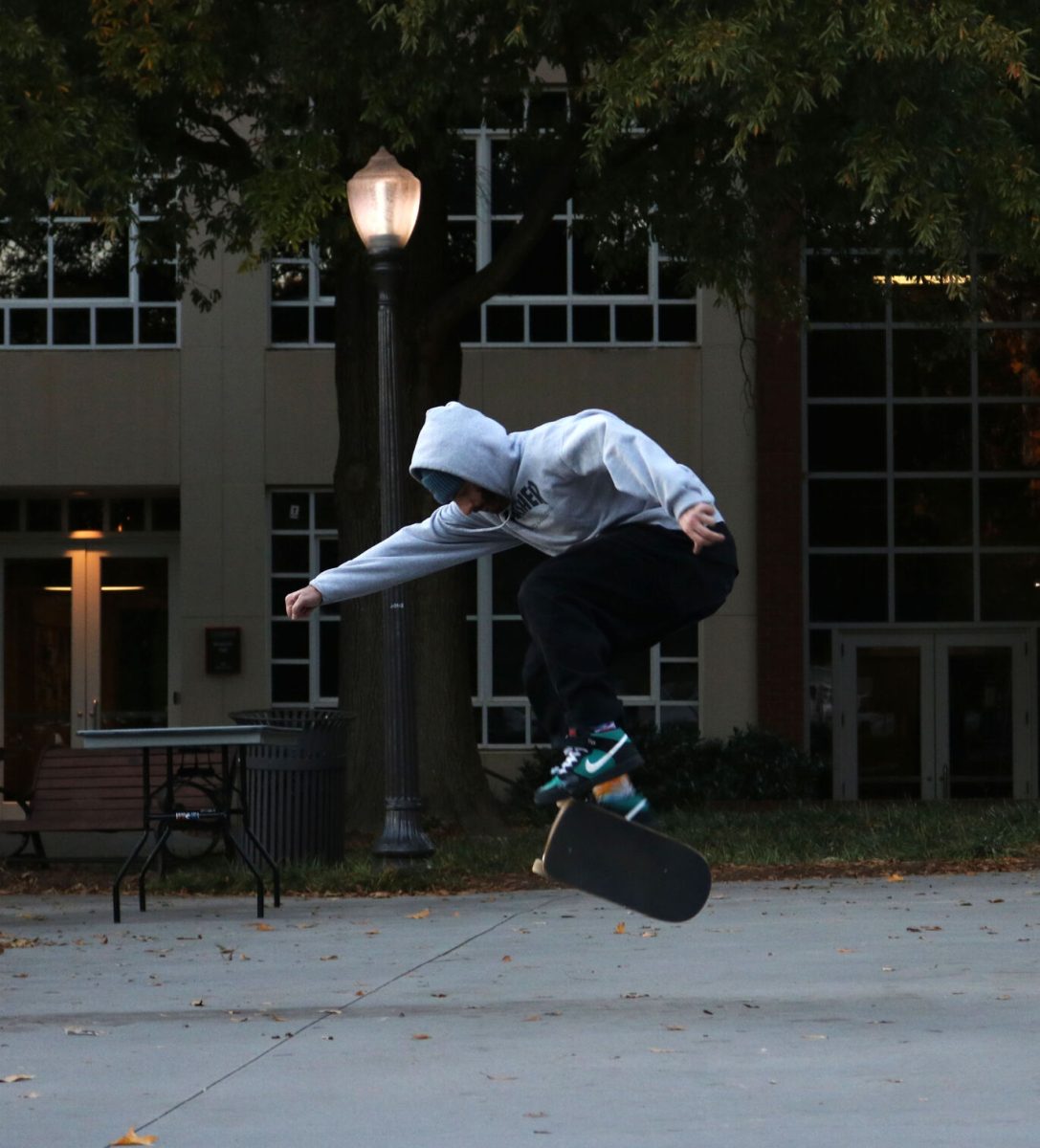 Clemson+skater+attempts+a+kick+flip.