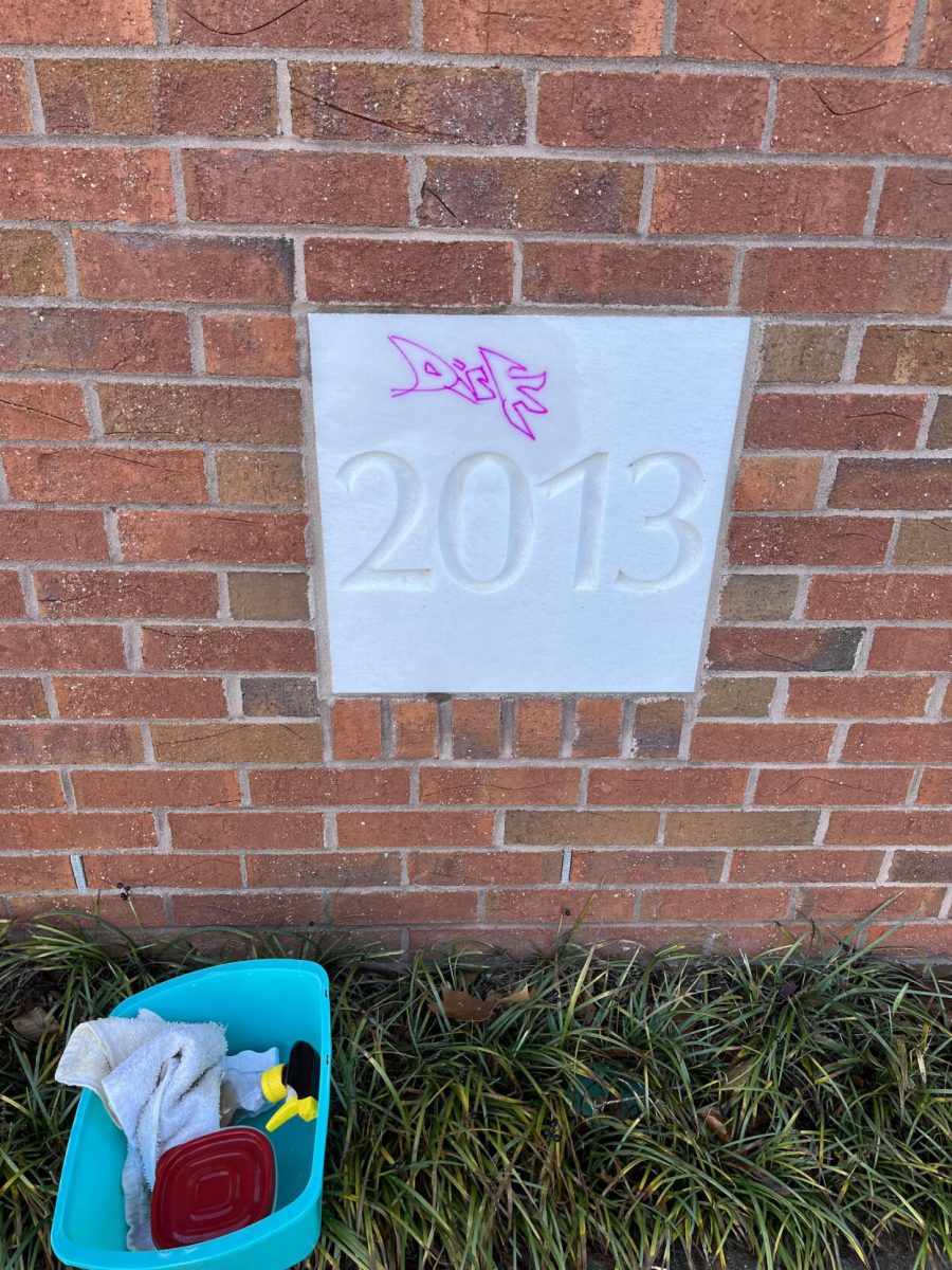 Graffiti on the one of the cornerstones of University Lutheran Church on Sloan Street. This incident in early January led the church to put up a new system of security cameras to curb the high rate of vandalism. This offending mark took over 20 manhours of work to remove.