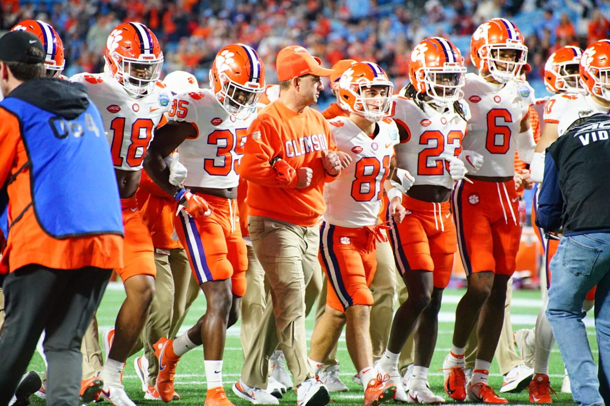 Clemson head coach Dabo Swinney walks across the field at Bank of America Stadium before the Tigers 39 - 10 victory over the North Carolina Tar Heels in the 2022 ACC Champhionship.