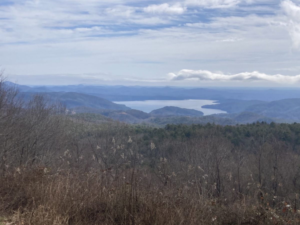 The view of Lake Jocassee and the foothills beyond with Paris Mountain in the background. This overlook is on the Wigington Memorial Highway, which connects SC-107 near Sloan Bridge to SC-130 (Whitewater Road) near the entrance to the Bad Creek Hydro Station, near the North Carolina border.
