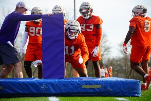 Clemson defensive tackle Peter Woods (11) goes through tackling drills at practice on March 6, 2023.