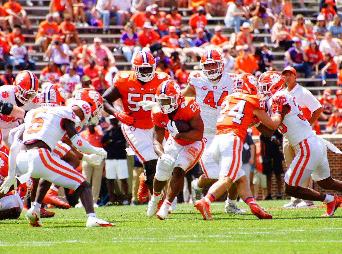 Clemson running back Dominique Thomas (20) runs up the middle during the Tigers Orange vs. White spring game in Memorial Stadium on April 15, 2023.