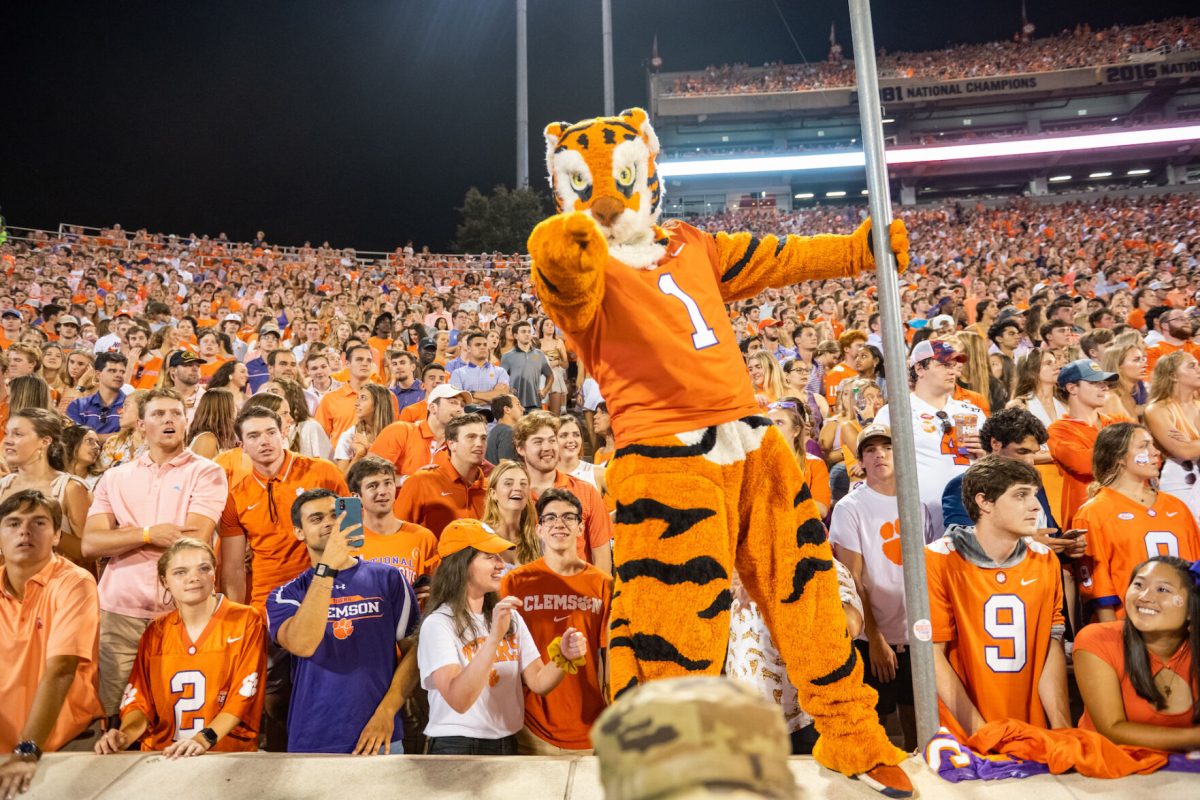 The Clemson Tiger points at the camera during a Clemson football game in Memorial Stadium. 