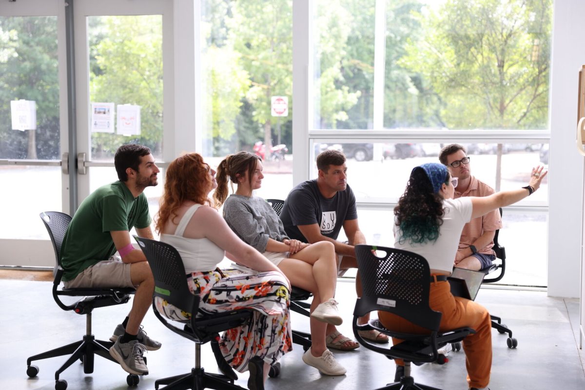 Clemson+students+gather+around+each+other+to+discuss+a+project.%26%23160%3B