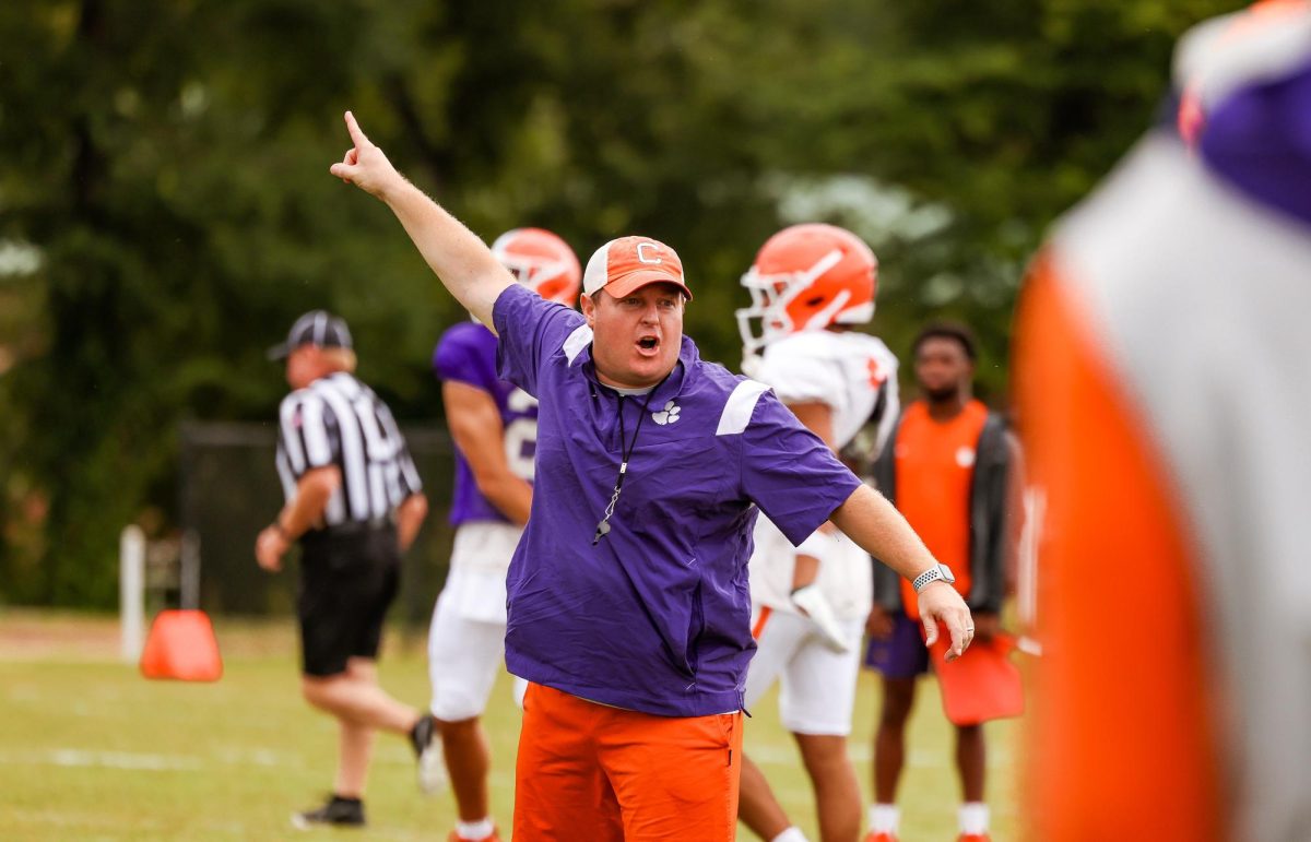 Clemson defensive coordinator Wes Goodwin speaks to his players during practice on Aug. 10, 2023.