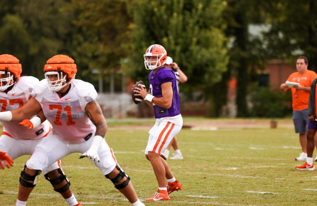Clemson quarterback Cade Klubnik scans the field during drills at practice on Aug. 10, 2023.
