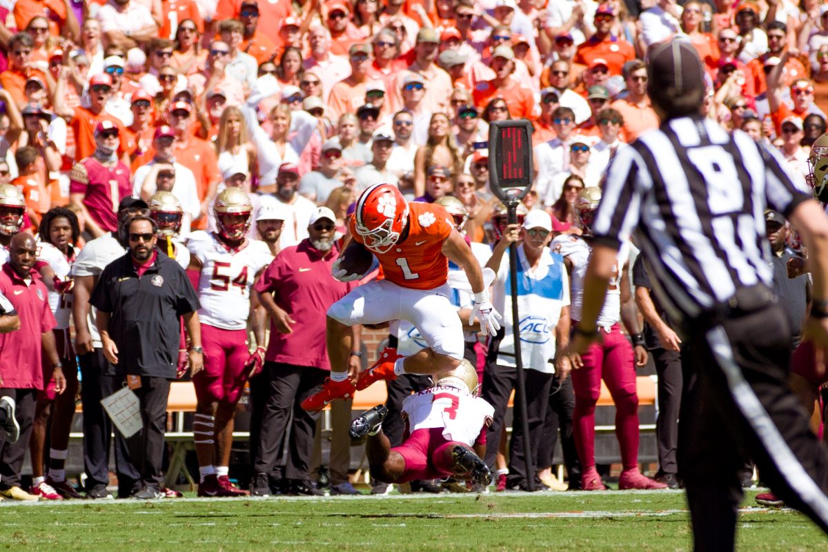 Clemson running back Will Shipley jumps a Florida State defender.