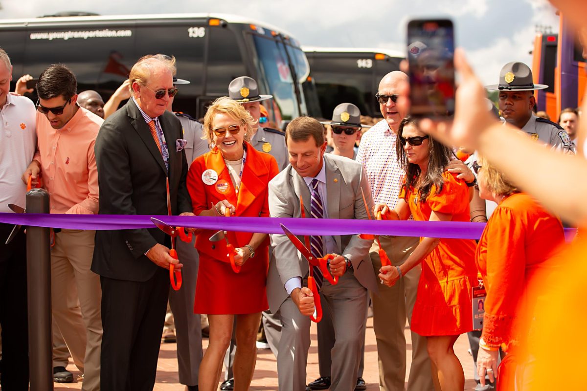 Head coach Dabo Swinney, Athletic Director Graham Neff and Clemson President Jim Clements took part in the Tiger Walk ribbon-cutting ceremony on Sept. 9 to applause from hundreds of fans.