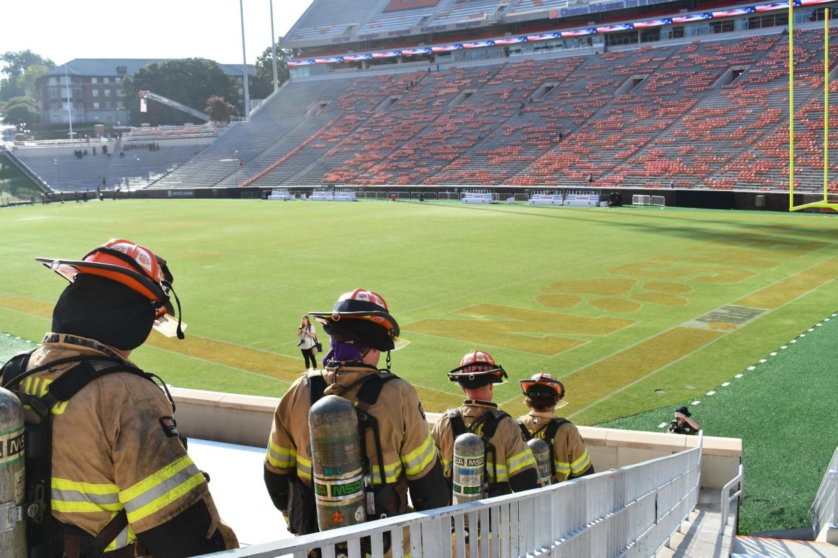 Clemson Firefighters, dressed in full gear, climb more than 100 flights of stairs at Clemson Universitys 2023 9/11 memorial stair climb event.