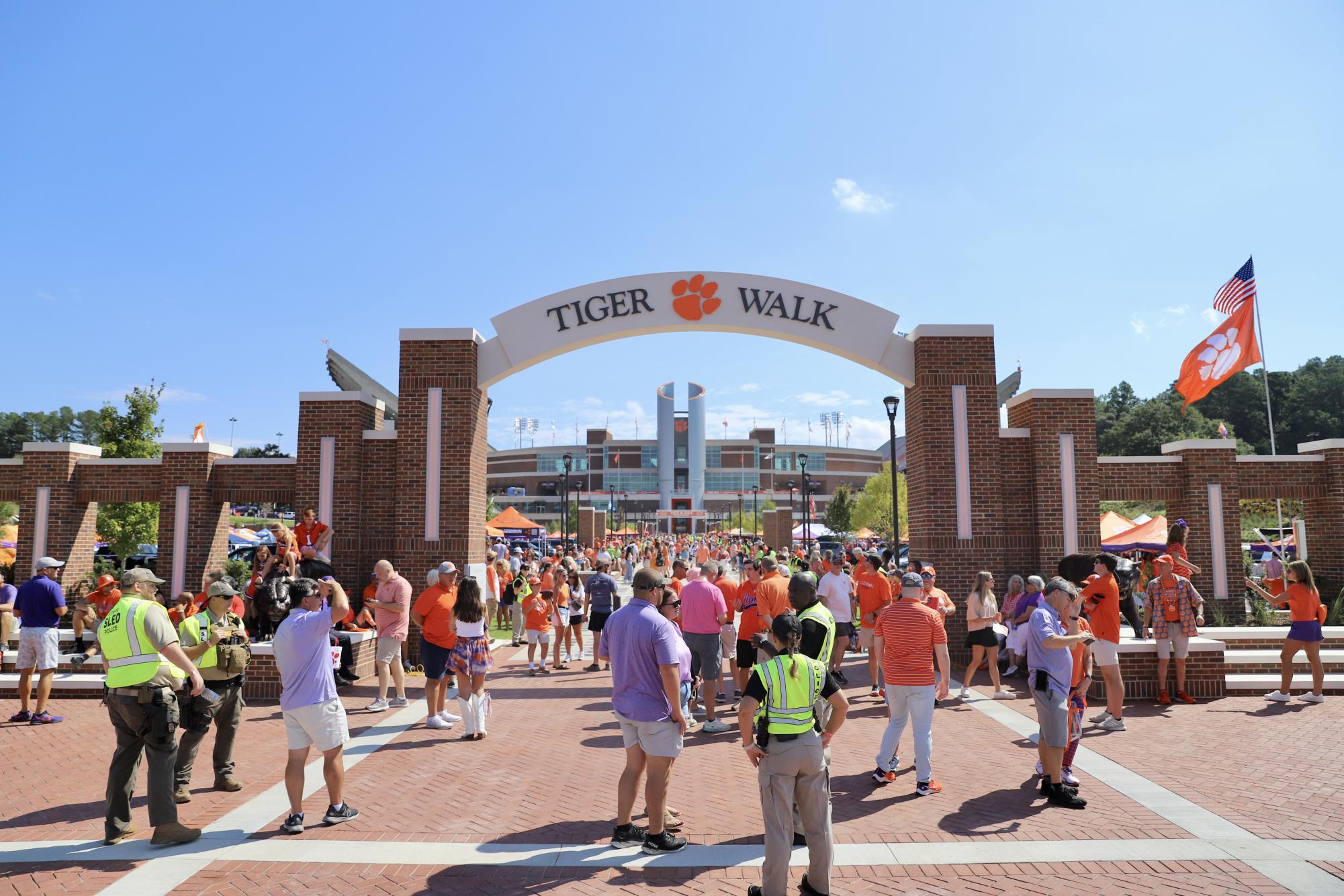 The Tigers enter Memorial Stadium before their home opener on their newly renovated Tiger Walk which features the names of every team captain in program history.