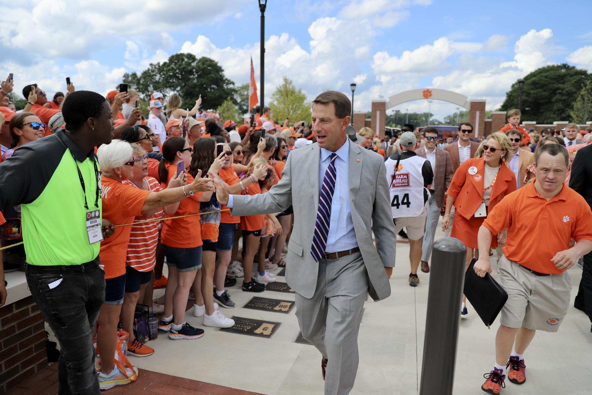 The Tigers enter Memorial Stadium before their home opener on their newly renovated Tiger Walk which features the names of every team captain in program history.