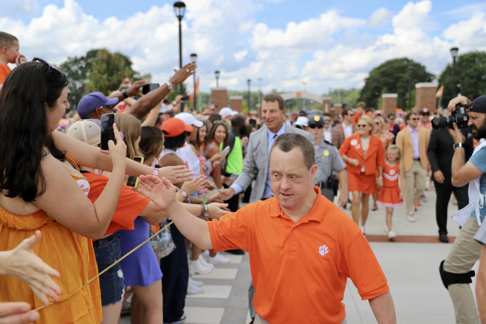 The Tigers enter Memorial Stadium before their home opener on their newly renovated Tiger Walk which features the names of every team captain in program history.