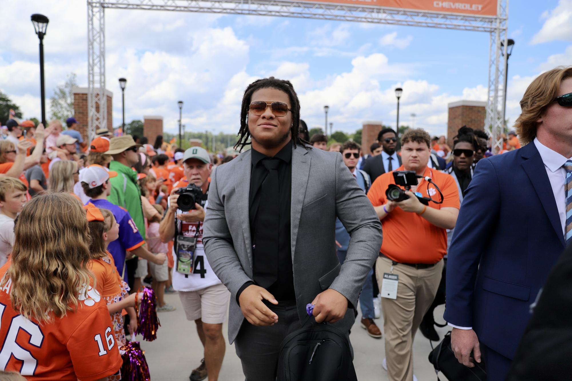 The Tigers enter Memorial Stadium before their home opener on their newly renovated Tiger Walk which features the names of every team captain in program history.