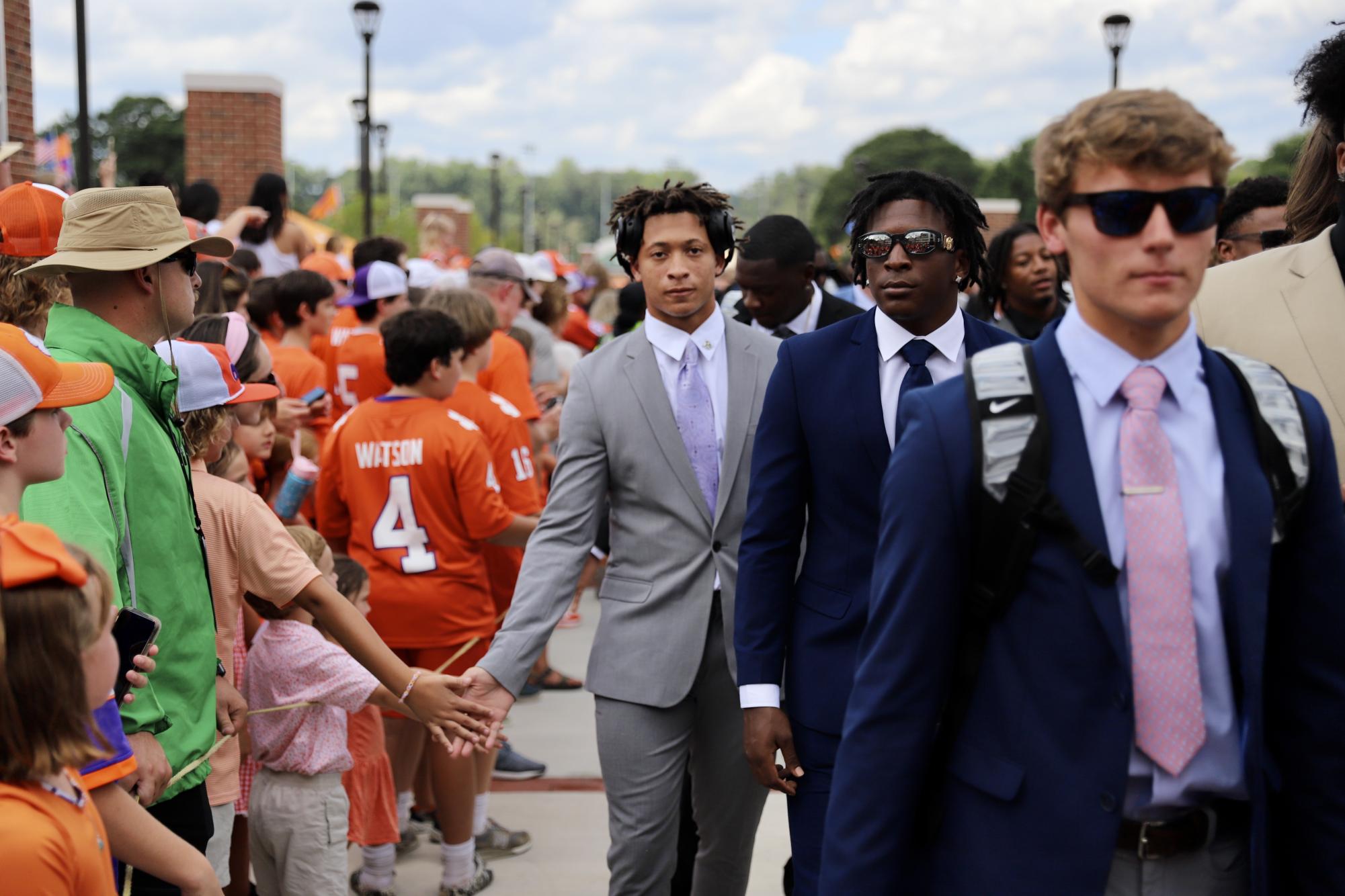 The Tigers enter Memorial Stadium before their home opener on their newly renovated Tiger Walk which features the names of every team captain in program history.