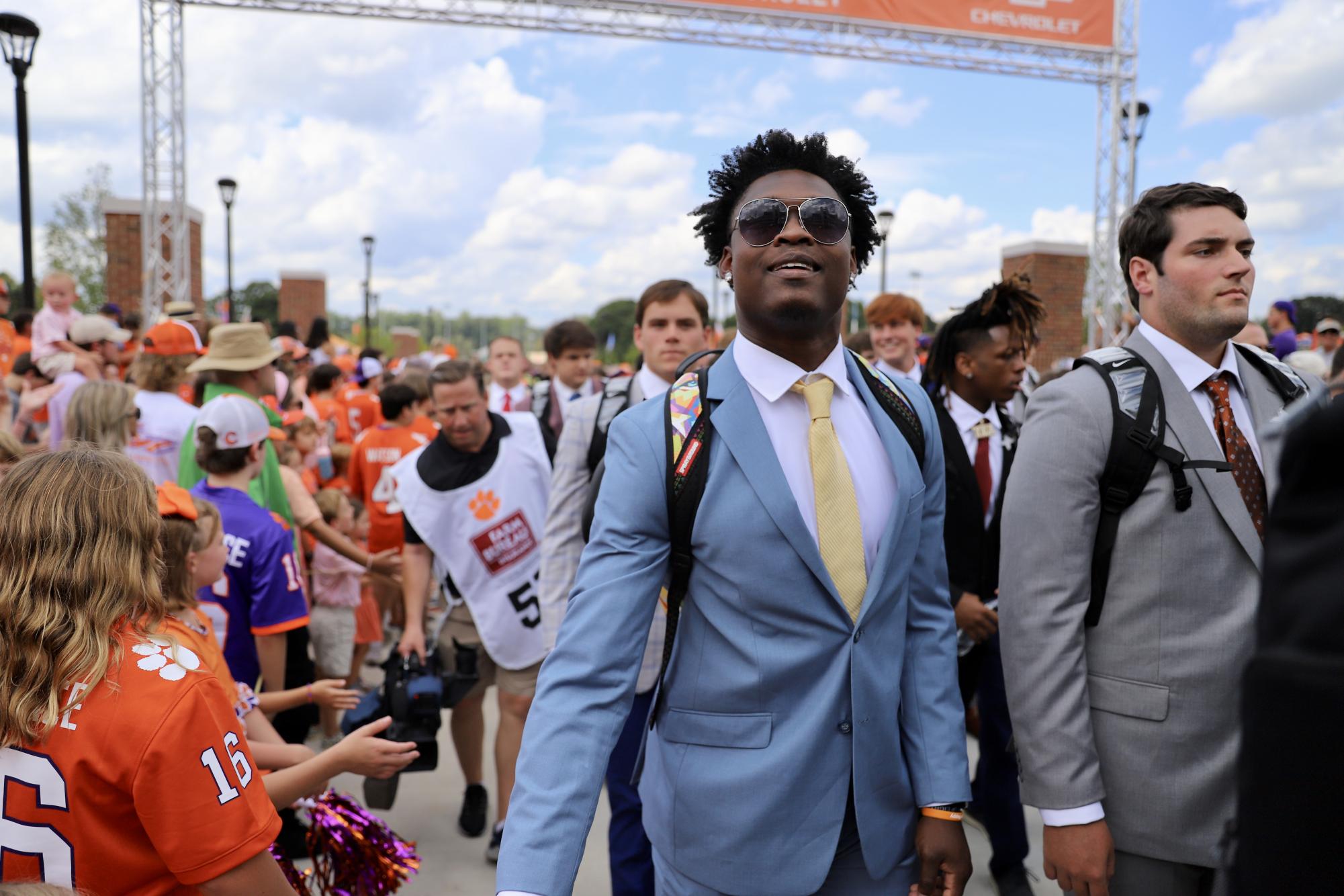 The Tigers enter Memorial Stadium before their home opener on their newly renovated Tiger Walk which features the names of every team captain in program history.