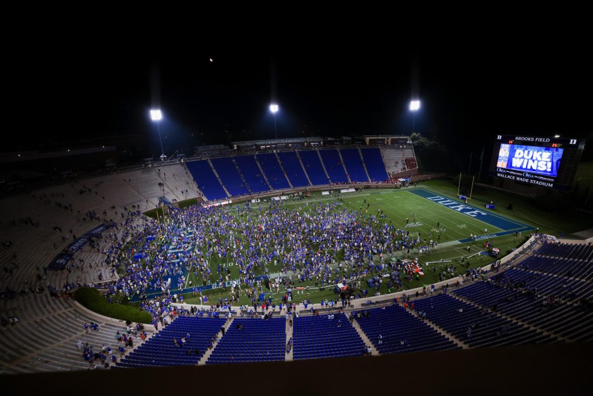 Duke fans storm the field after defeating No. 9 Clemson on Sept. 4, 2023.
