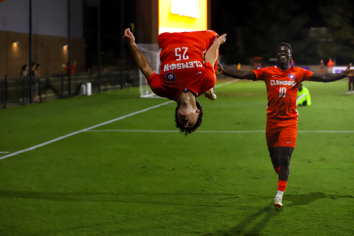 Nathan Richmond (25) and Ousmane Sylla (11) celebrate at Historic Riggs Field.