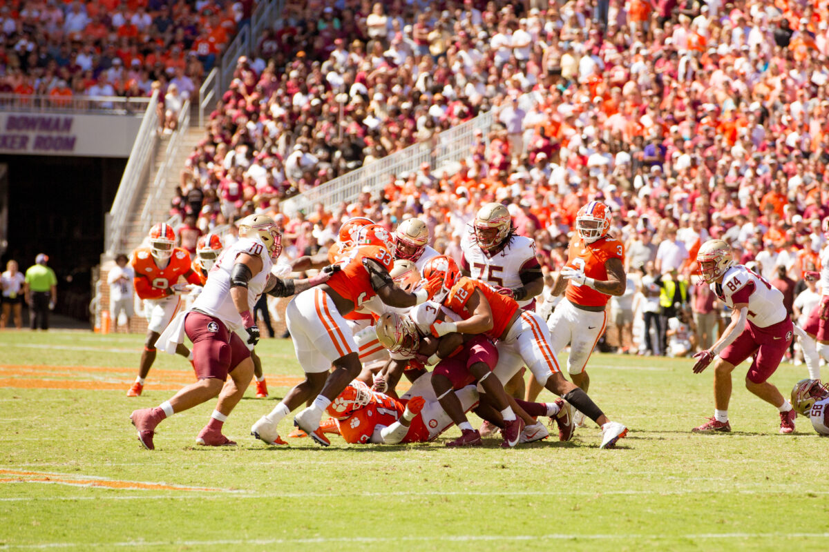 Clemsons defense has been the critical factor keeping the Tigers in their games. Pictured tackling Florida States ball carrier is Ruke Orhorhoro (33) and T.J. Parker (12).