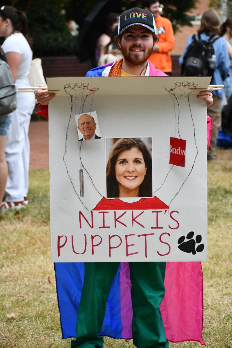 One poster includes an image of Nikki Haley that suggested she is the puppetmaster of Clemson leaders. 