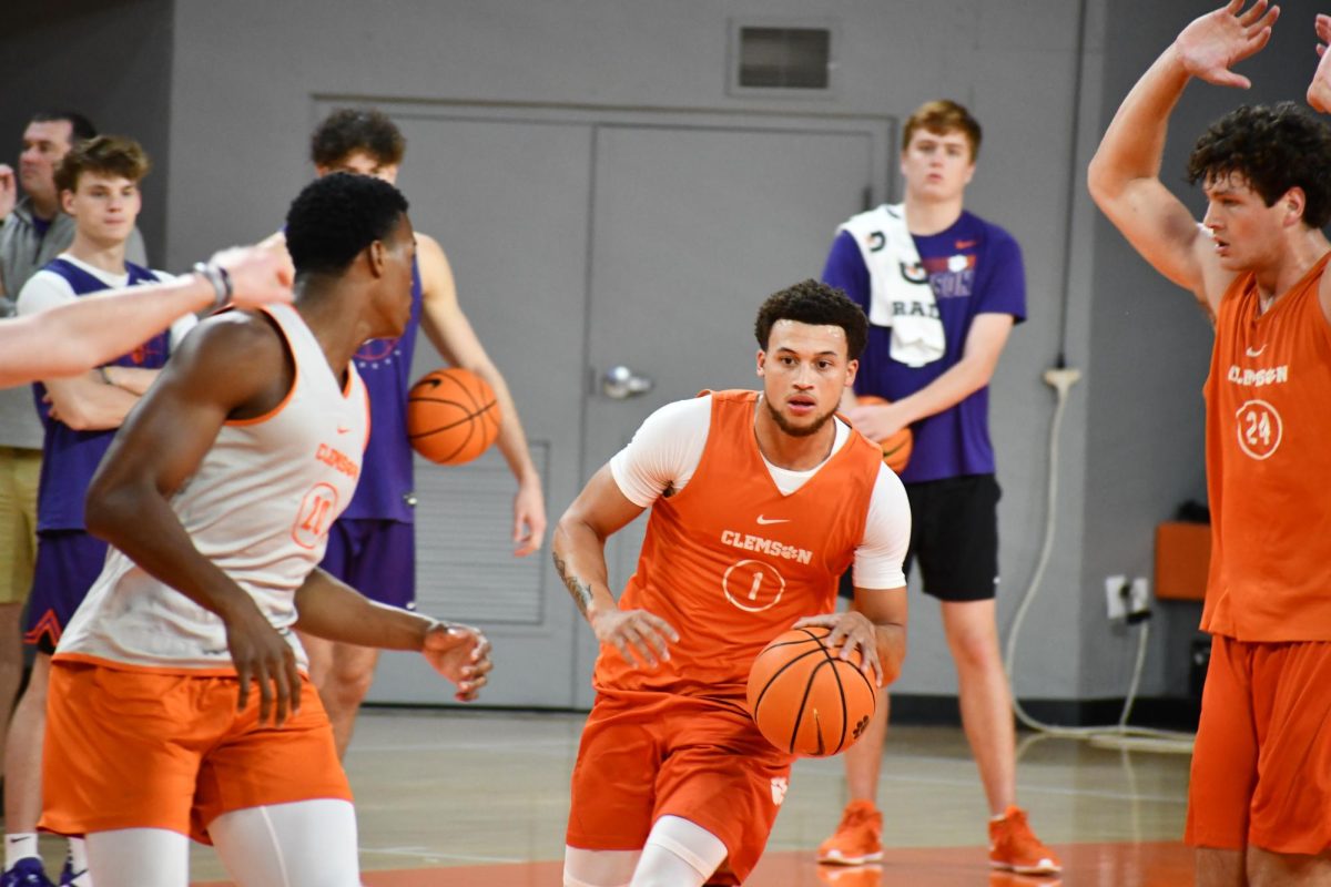 Clemson guard Chase Hunter dribbles the ball up the court in Littlejohn Coliseum on Oct. 12, 2023.