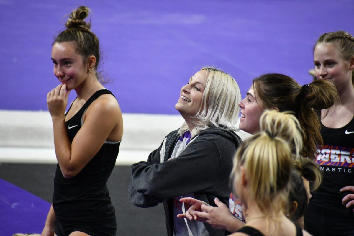 Clemson gymnastics head coach Amy Smith talks with her team during practice in Littlejohn Coliseum on Oct. 17, 2023.
