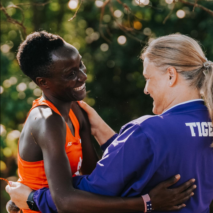 Chepngetich embraces coach Pounds after taking the first place finish at the Furman Invitational