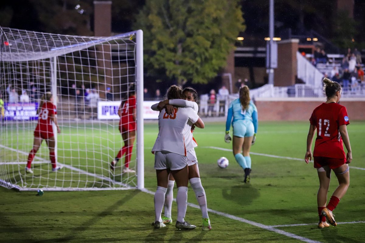 Forward Caroline Conti and defender Makenna Morris hug after scoring a goal during the first round of the NCAA tournament at Historic Riggs Field on Friday, Nov. 10.