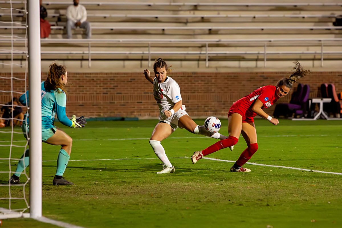 Forward Caroline Conti flicks the ball past a defender during the first round of the NCAA tournament at Historic Riggs Field on Friday, Nov. 10.