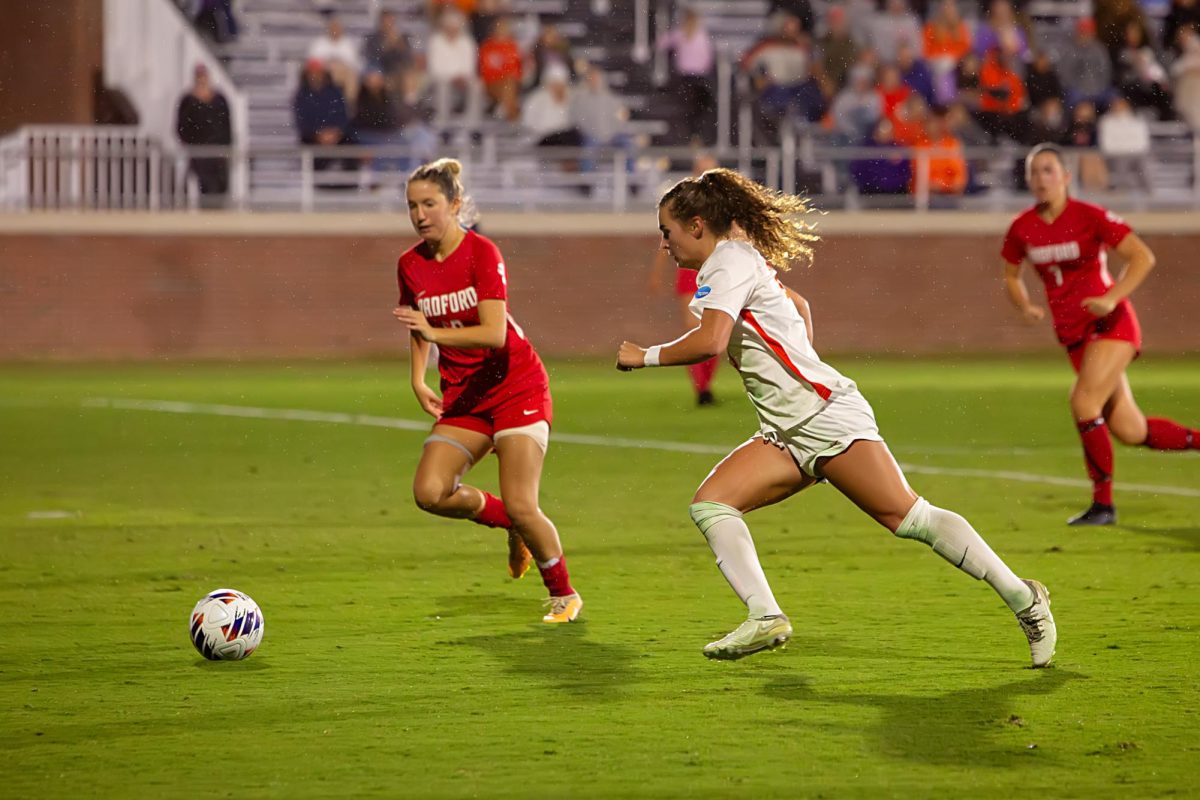 Forward Caroline Conti dribbles up the field during the first round of the NCAA tournament at Historic Riggs Field on Friday, Nov. 10.