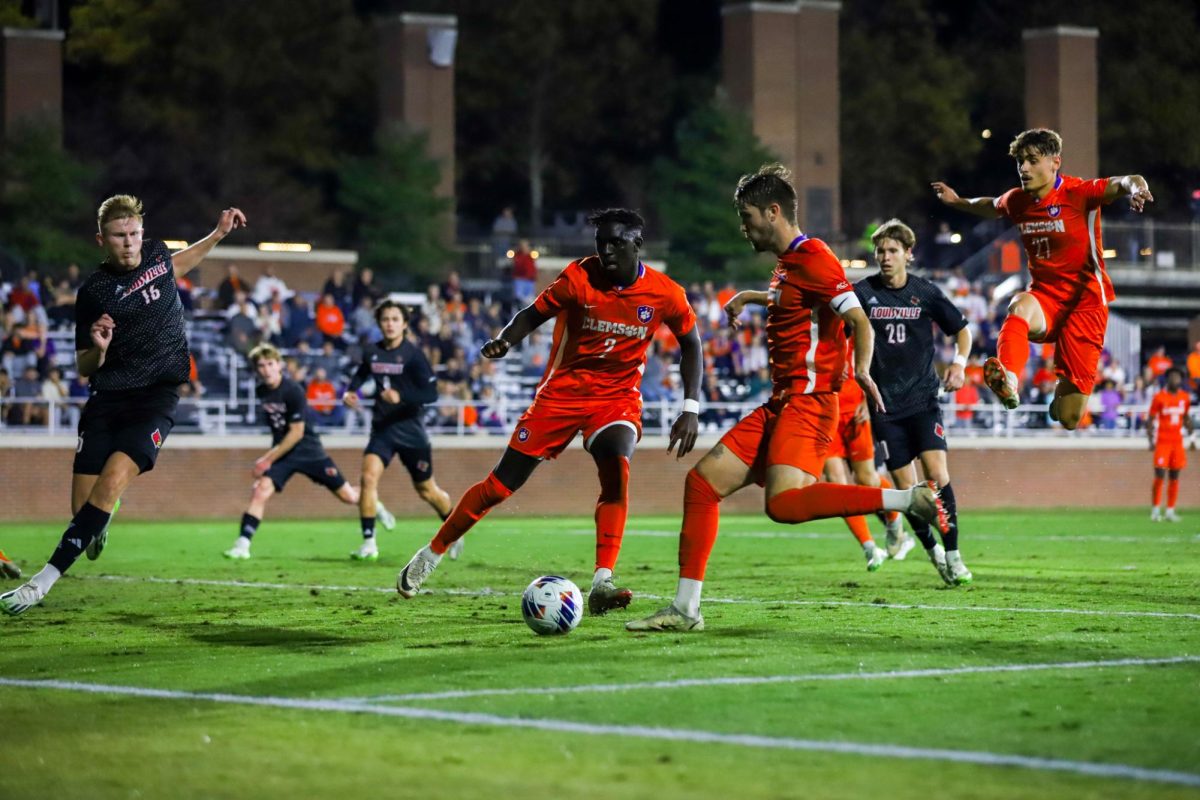 Clemson defender Adam Lundegard shoots as defender Pape Mar Boye watches during the ACC semifinal at Historic Riggs Field on Wednesday, Nov. 8.