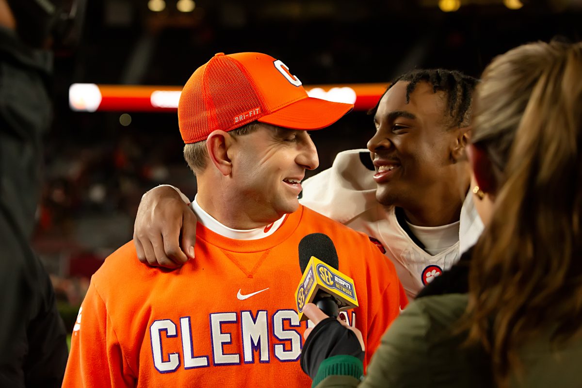 Head coach Dabo Swinney and freshman safety Khalil Barnes celebrate the win against South Carolina in Williams-Brice Stadium on Nov. 25, 2023.