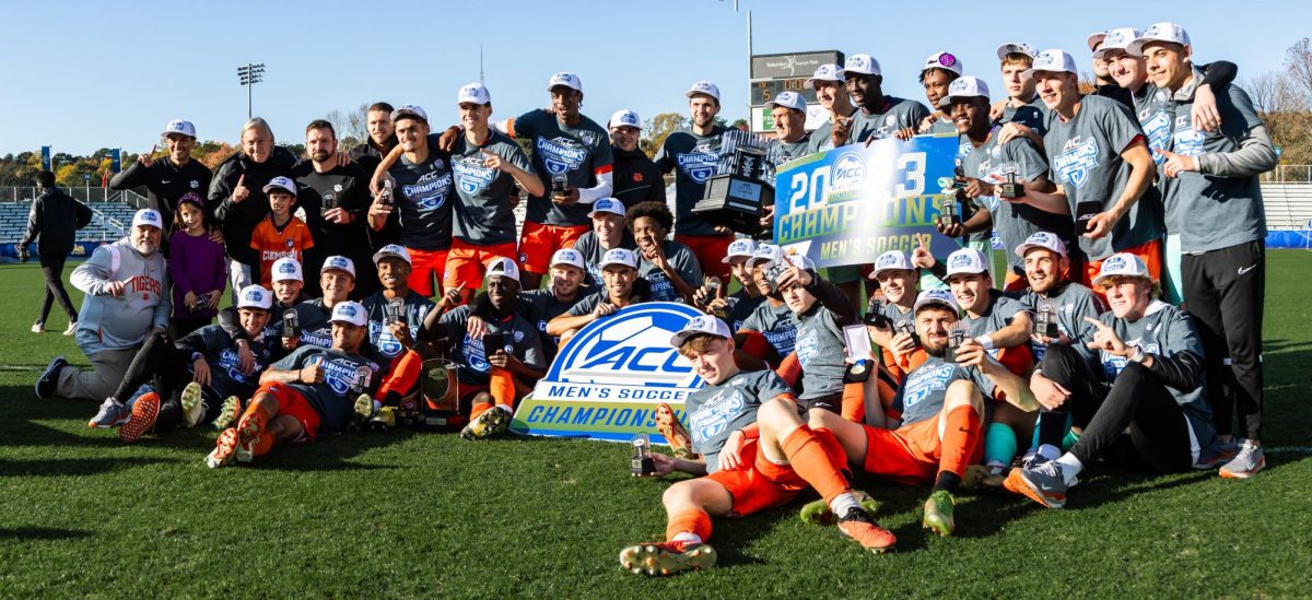 The Clemson team poses with its trophy after winning the ACC Championship in Cary, North Carolina, on Sunday, Nov. 12.