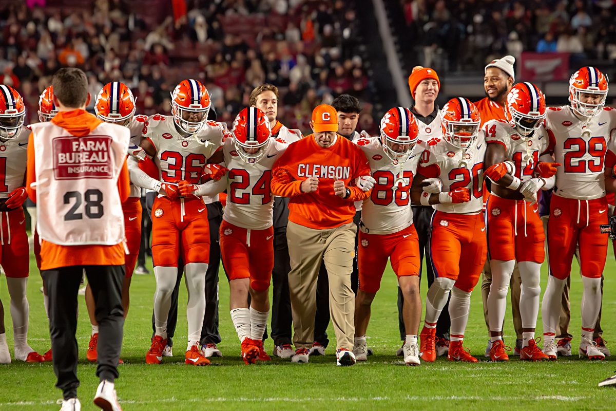 The Clemson football team, including safety Khalil Barnes (36), performs the Walk of Champions ahead of its game against South Carolina on Nov. 25, 2023.