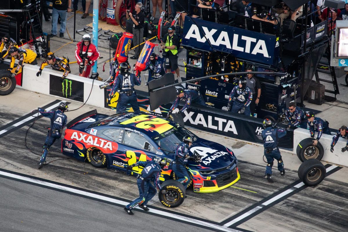 Walker can be seen holding the large gas can behind the wall at the Daytona 500 in 2019.