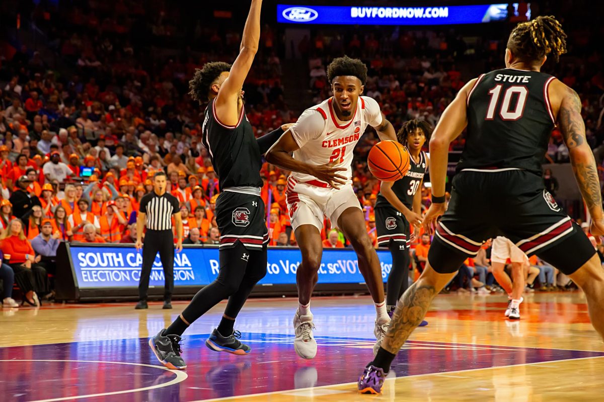 Clemson forward Chauncey Wiggins dribbles into the paint in the Tigers game against South Carolina in Littlejohn Coliseum on Dec. 6, 2023.