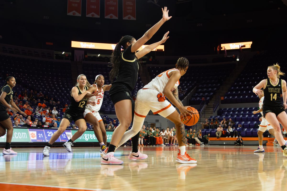 Amari Robinson (5) looks for a pass from teammate Ruby Whitehorn (22) in the Tigers victory over Wake Forest on Sunday.