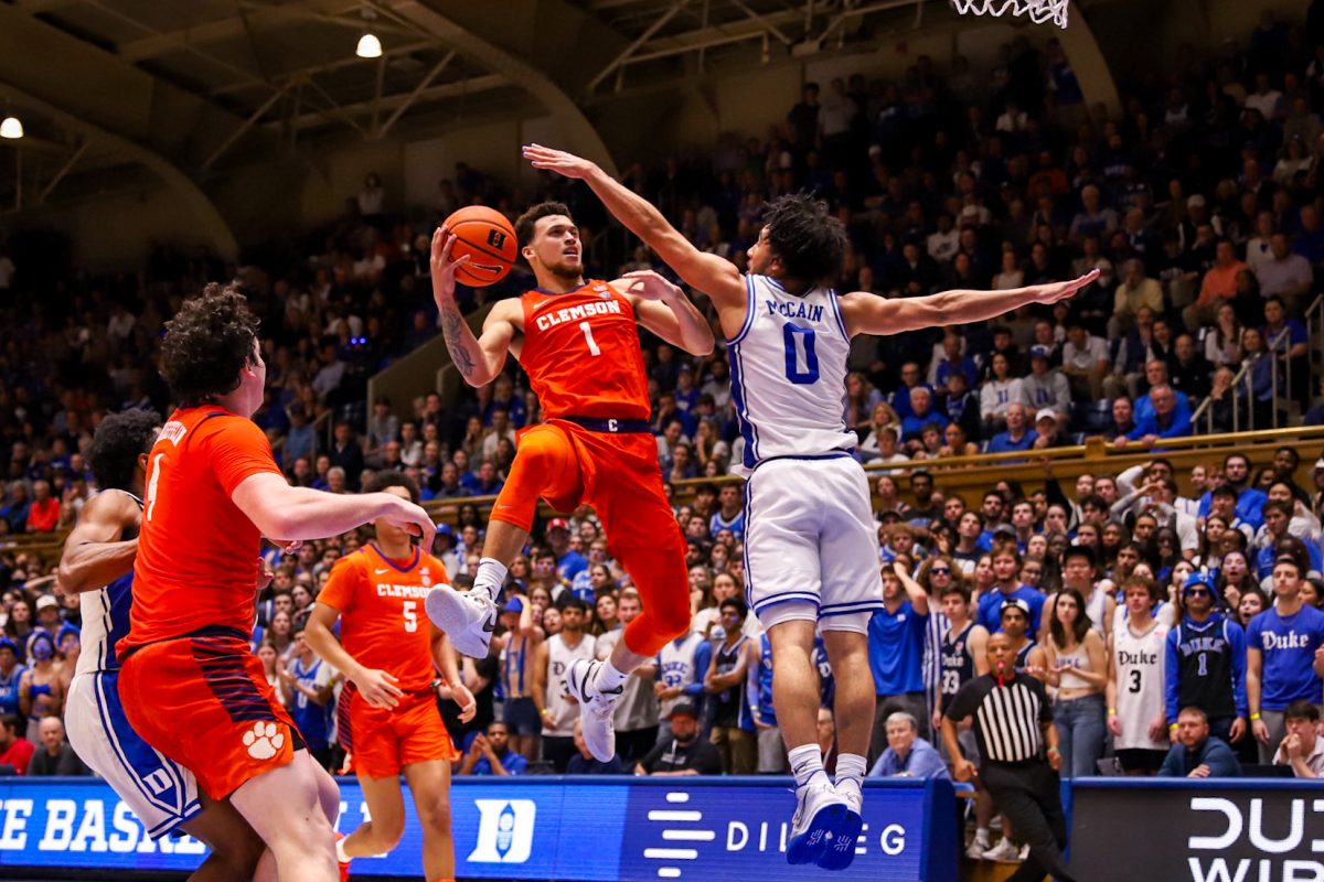 Clemson guard Chase Hunter attempts to score over Dukes Jared McCain in Cameron Indoor Stadium on Jan. 27, 2024.