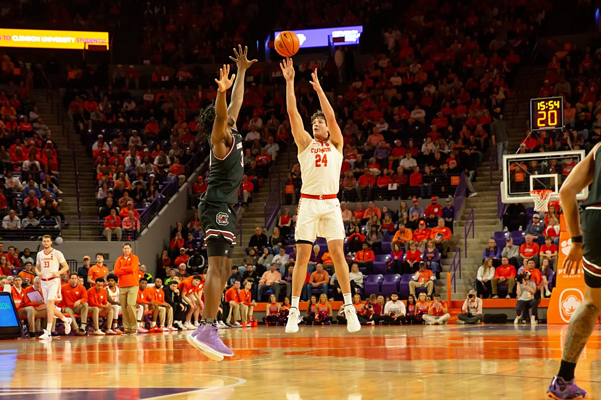 Clemsons leading scorer PJ Hall sends a shot past an outstretched defender in the Tigers 72-67 win over South Carolina last month.