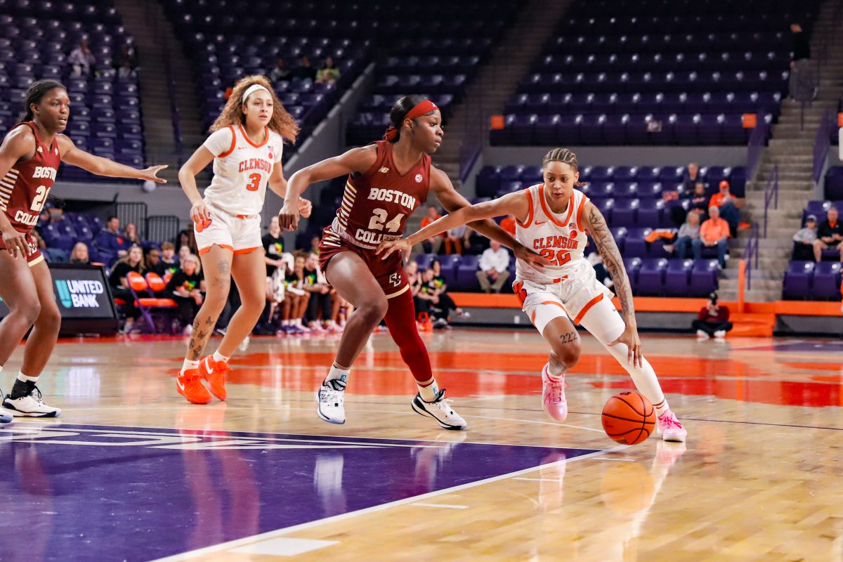Clemson guard Ruby Whitehorn (22) attempts to dribble past a defender in Clemsons win over Boston College at Littlejohn Coliseum on Feb. 1, 2024.