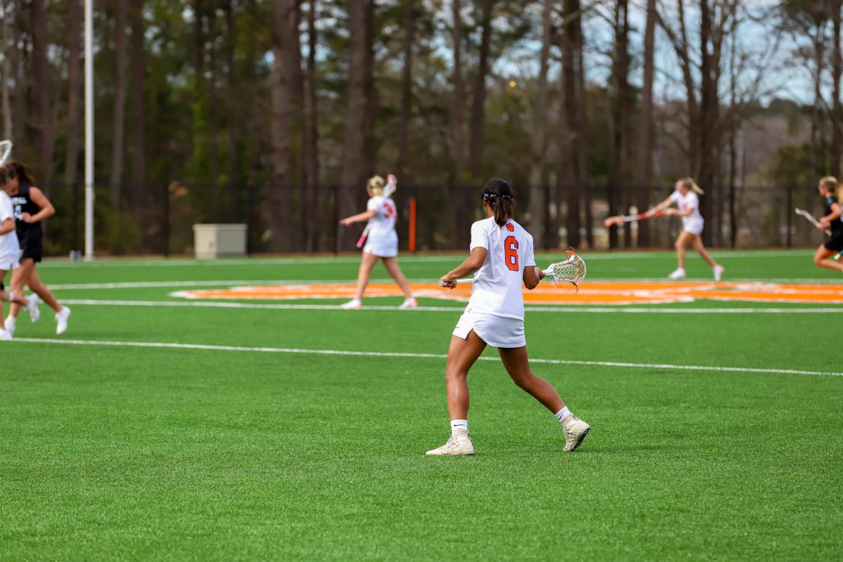 Freshman attacker Jasmine Stanton (6) watches the ball from afar in the Tigers 16-5 victory over Coastal Carolina last weekend; Stanton recorded her first career hat trick in the game.
