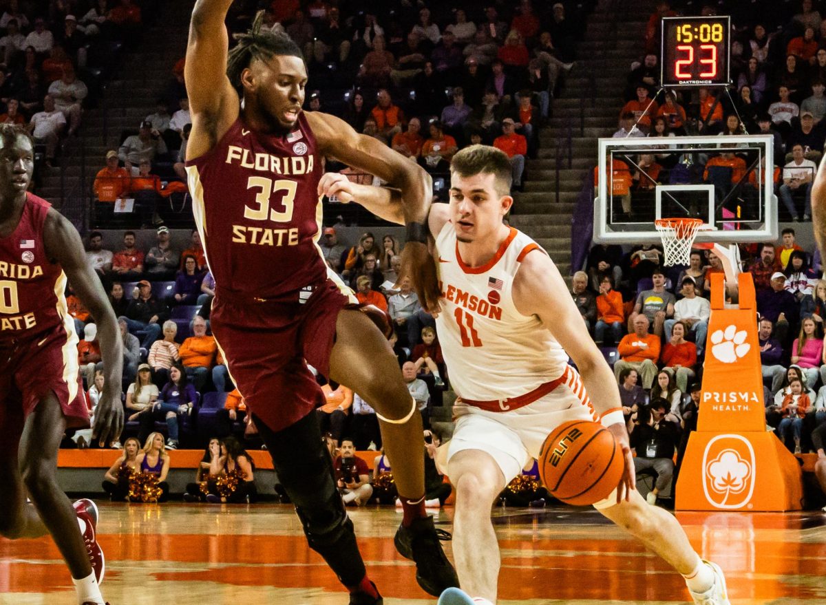 Clemson guard Joseph Girard III dribbles into the paint in the Tigers game against Florida State in Littlejohn Coliseum on Feb. 24, 2024.
