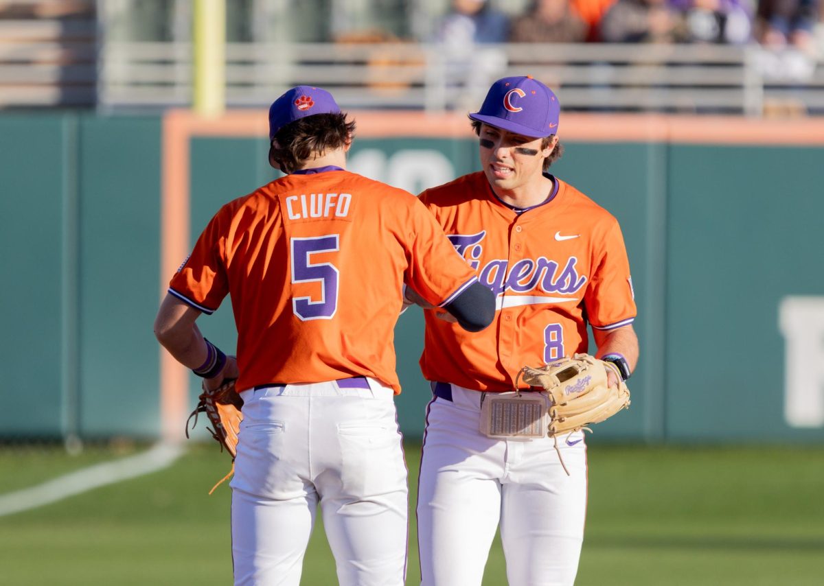 Clemsons Blake Wright (8) and Andrew Ciufo celebrate during the Tigers game against Kennesaw State in Doug Kingsmore Stadium on Feb. 24, 2024.