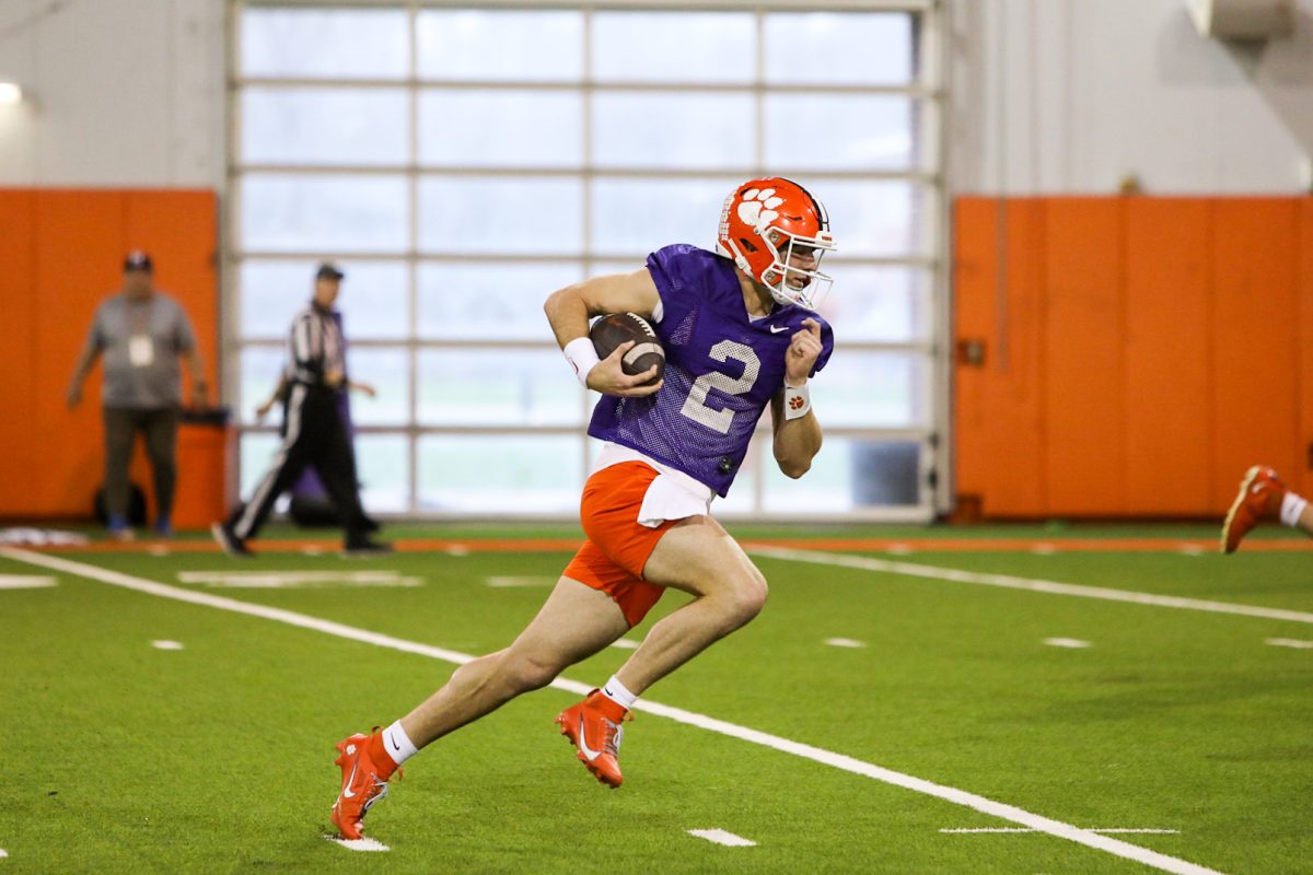 Clemson quarterback Cade Klubnik runs with the ball during the second day of spring practice on March 1, 2024.