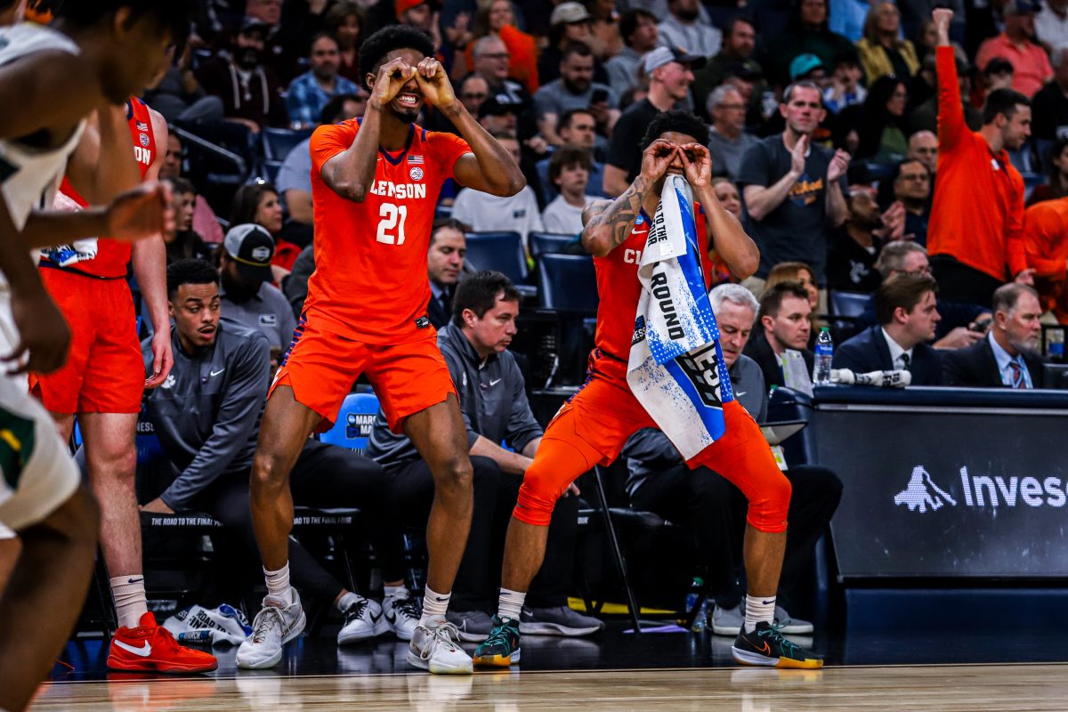 Forward Chauncey Wiggins (left) and guard Dillon Hunter (right) celebrate on the bench during the game against Baylor in the second round of the NCAA Tournament in Memphis, Tennessee, on March 24, 2024.