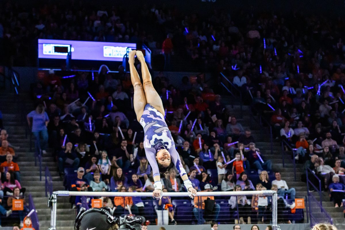 Senior Kaitlin DeGuzman, pictured on bars, had a stellar final home meet with the Tigers as she tied her career-best and earned a meet-high 9.925 for the event.