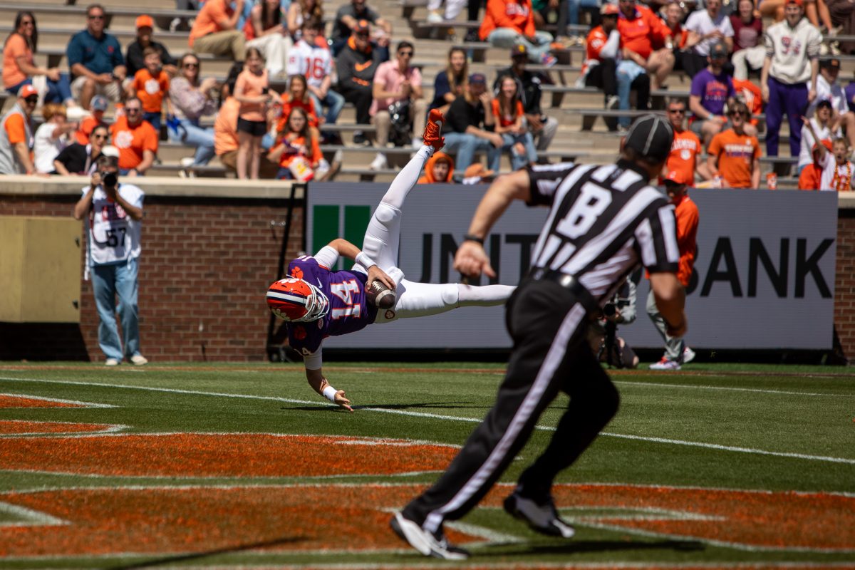 Redshirt sophomore Trent Pearman did not get to display his talents often last season, but shone in the spring game with his exceptional passing and rushing abilities; pictured somersaulting into the end zone for Team Orange.