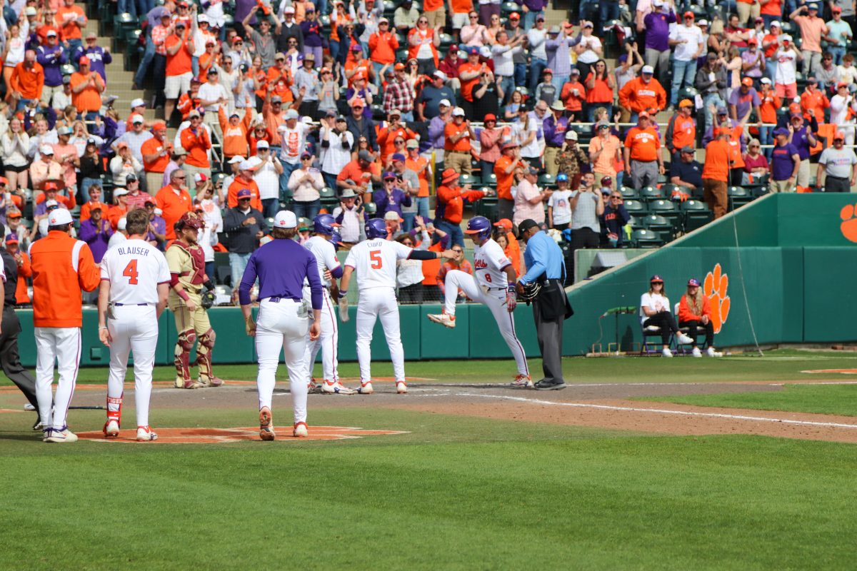 Blake Wright stomps on home plate after crushing a grand slam to give Clemson a 13-11 lead late in the final game of the series over the No. 7 Florida State Seminoles.