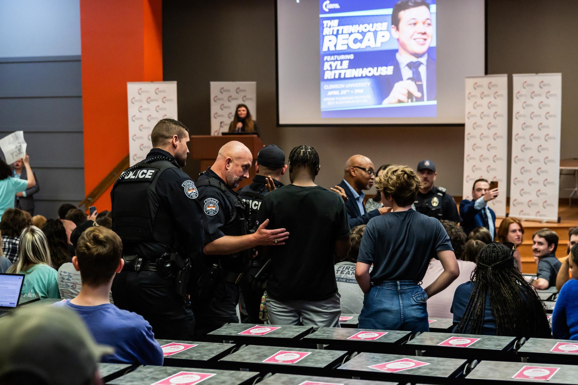 Several protesters were removed by CUPD police officers for chanting "save live, not bullets" during Clemson TPUSA's event hosting Kyle Rittenhouse.