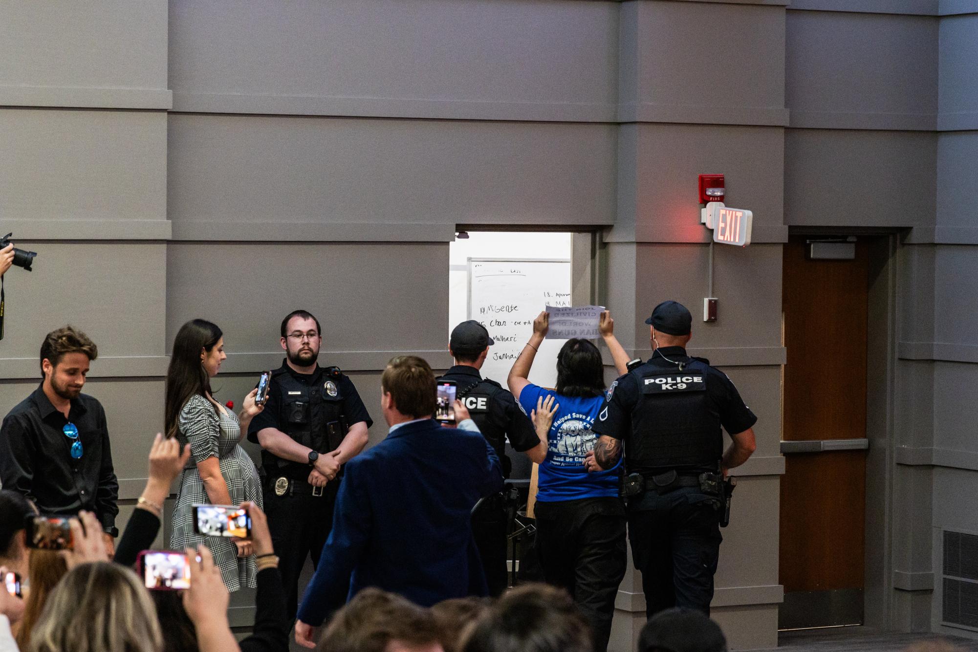 Several protesters were removed by CUPD police officers for chanting "save live, not bullets" during Clemson TPUSA's event hosting Kyle Rittenhouse.